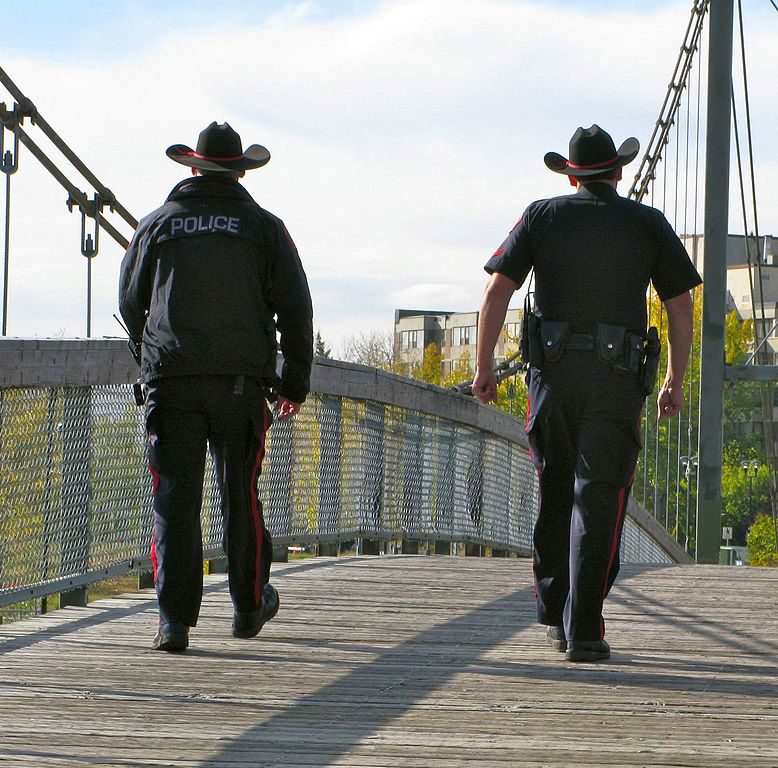 Calgary police officers on patrol. Photo courtesy Heather/Creative Commons Attribution 2.0 Generic.