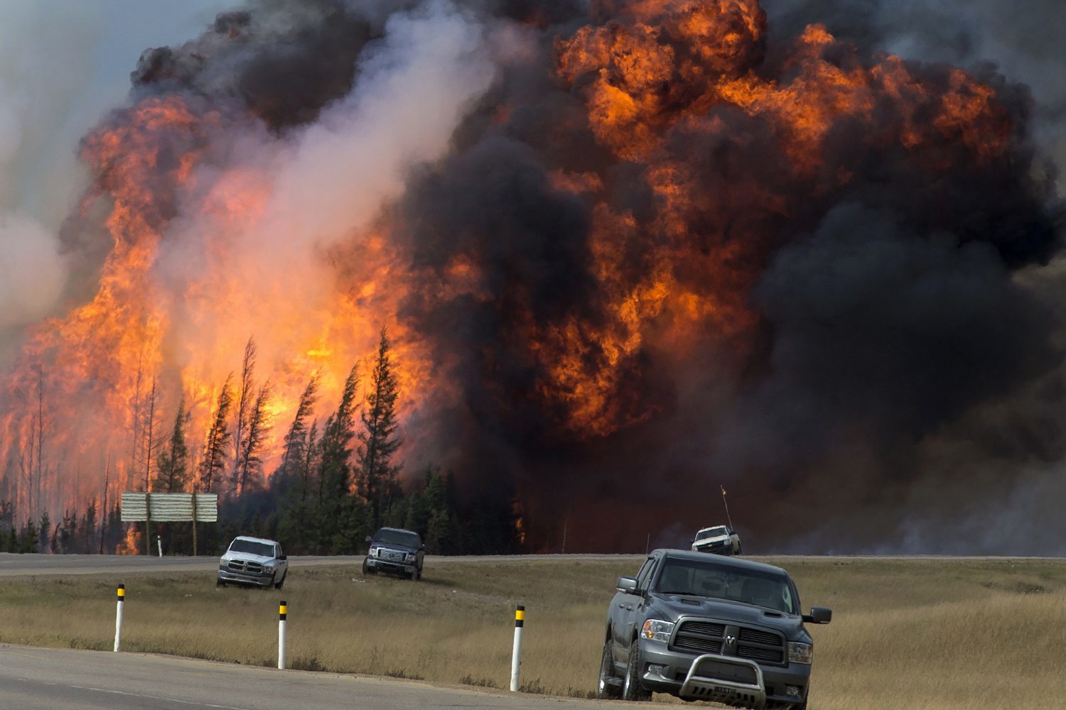 A raging wildfire consumes the forest next to Highway 63 twenty four kilometres south of Fort McMurray in May 2016. Photo courtesy Chris Schwarz/Government of Alberta.