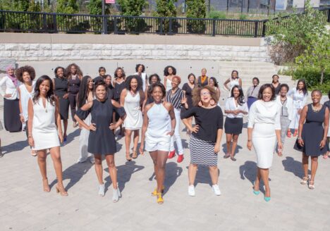 About 30 black women working in media stand for a historic photo at the corner of Queen Street and Dufferin Street in Toronto. Photo courtesy Lawrence Kerr.