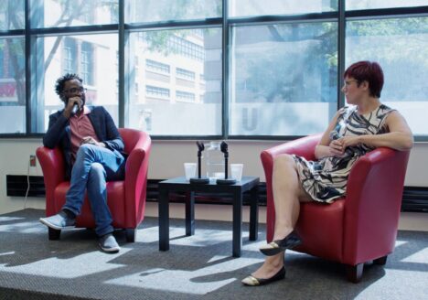 Ugandan director Kamoga Hassan discusses his film, “Outed: The Painful Reality,” with journalist and queer media instructor Andrea Houston. Photo courtesy Jessica Ross.