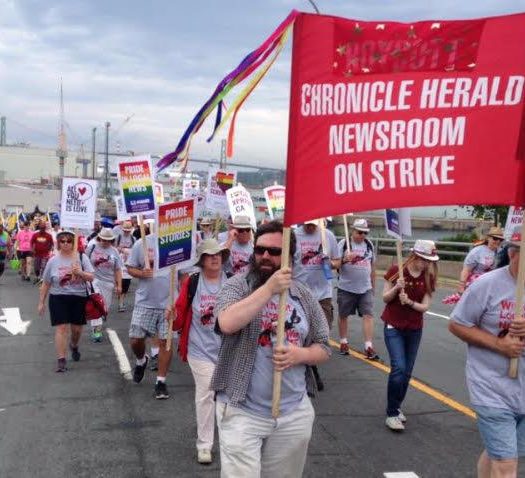 Long road: Chronicle Herald strikers at a Halifax pride parade back in June. Photo courtesy Tim Krochak.