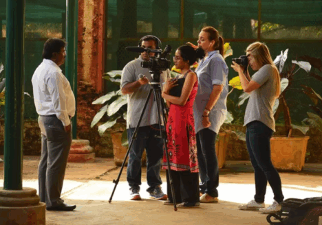The Bangalore food team interviews a state government official about food security in the city’s renowned Lalbagh Botanical Garden. Photo by Prabhu Mallikarjunan/Courtesy of the Tyee.