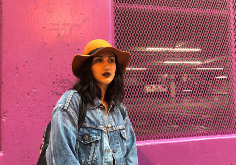 Anya Zoledziowski pictured in front of pink wall