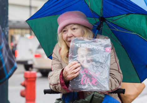 Joan M. sells copies of Megaphone Magazine in Downtown Vancouver in 2018
