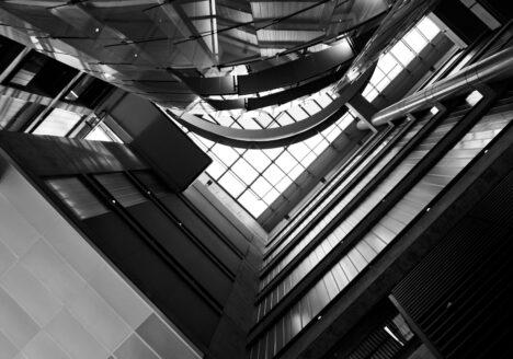 The interior of the Bahen Centre for Information Technology in black and white.