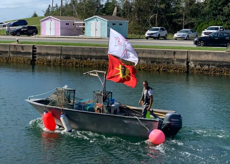 Craig Doucette heads out on to the St. Peter’s Bay to set traps, as he asserts his treaty rights under the Potlotek First Nation’s moderate livelihood fishery plan