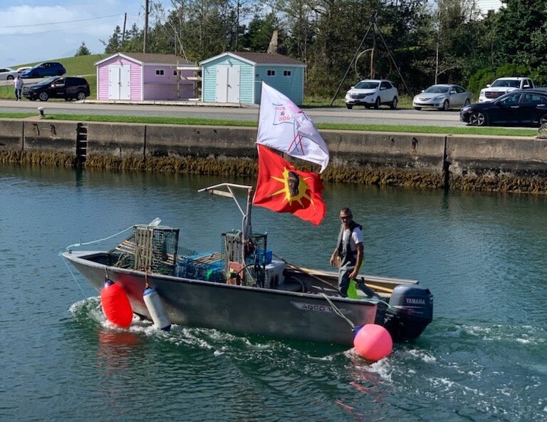 Craig Doucette heads out on to the St. Peter’s Bay to set traps, as he asserts his treaty rights under the Potlotek First Nation’s moderate livelihood fishery plan
