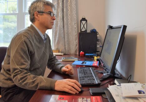 Khosro Shemiranie, HafteH’s publisher and editor-in-chief, works in his Montreal office.