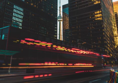 CN Tower at Sunset with light trails from a Fire Truck whizzing by.