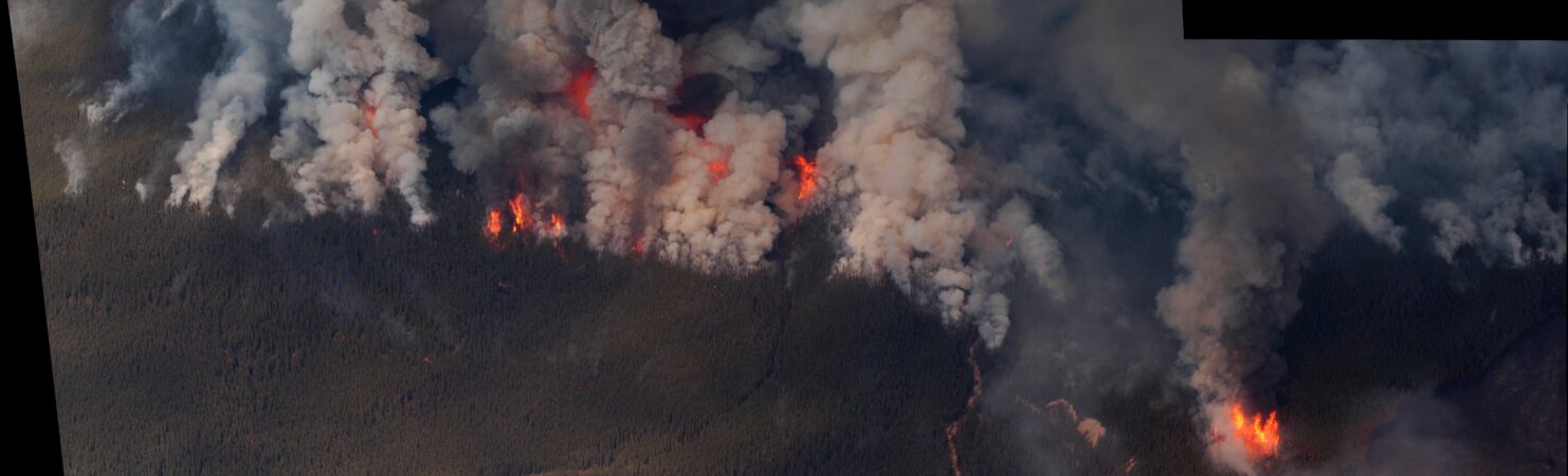 Stitched panorama aerial view of a forest fire in Alberta