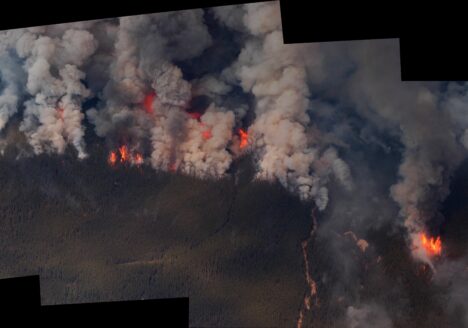 Stitched panorama aerial view of a forest fire in Alberta