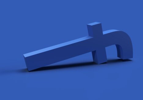 3d render the blue symbol facebook has fallen and is lying down, on blue background.