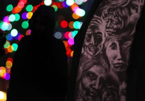 A woman stands next to the Women’s Monument in London, Ont., as people gather to mark the 25th anniversary of the ÉcolePolytechnique massacre in 2014. THE CANADIAN PRESS//Dave Chidley