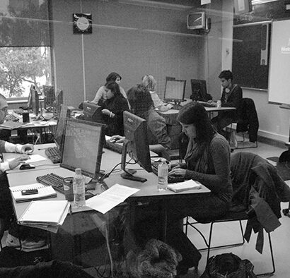 Students at work in a journalism classroom. Photo by Gary Gould, X University