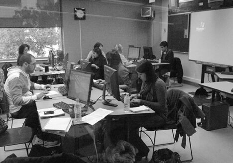 Students at work in a journalism classroom. Photo by Gary Gould, X University