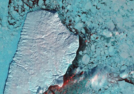 In far northern Canada, pulses of freshwater flow down rivers after inland ice and snow melts. These pulses, known as a freshet, carry huge amounts of sediment. The sediment seen in this image flowed into the Beaufort Sea from the Mackenzie River, the longest northward-flowing river in North America. White, light blue and red