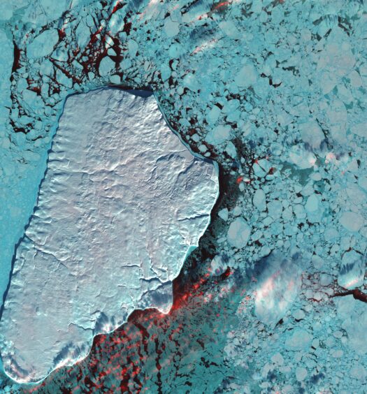 In far northern Canada, pulses of freshwater flow down rivers after inland ice and snow melts. These pulses, known as a freshet, carry huge amounts of sediment. The sediment seen in this image flowed into the Beaufort Sea from the Mackenzie River, the longest northward-flowing river in North America. White, light blue and red