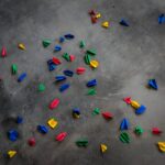 Red, blue, green and yellow paper planes on ground