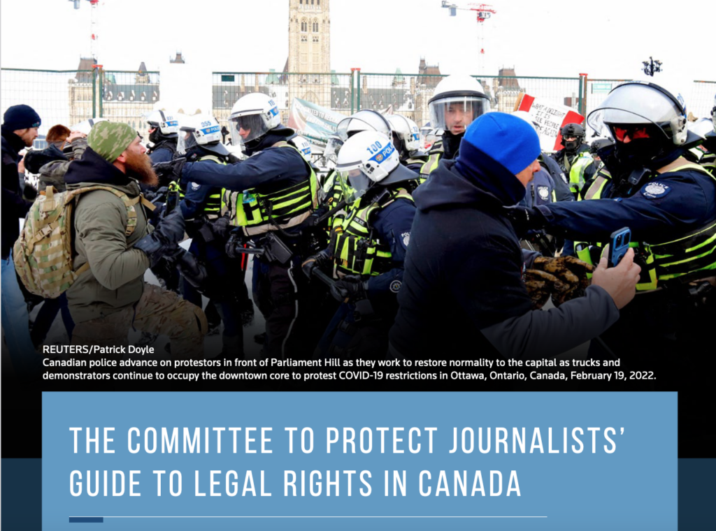 Canadian police advance on protestors in front of Parliament Hill. Text overstop image reads: REUTERS/Patrick Doyle Canadian police advance on protestors in front of Parliament Hill as they work to restore normality to the capital as trucks and demonstrators continue to occupy the downtown core to protest COVID-19 restrictions in Ottawa, Ontario, Canada, February 19, 2022 The Committee to Protect Journalists’ Guide to Legal Rights in Canada