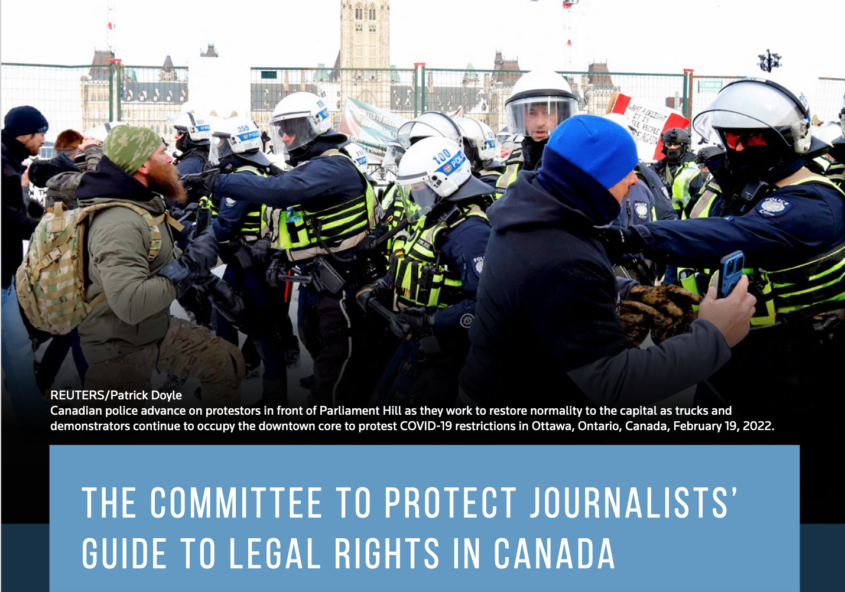 Canadian police advance on protestors in front of Parliament Hill. Text overstop image reads: REUTERS/Patrick Doyle Canadian police advance on protestors in front of Parliament Hill as they work to restore normality to the capital as trucks and demonstrators continue to occupy the downtown core to protest COVID-19 restrictions in Ottawa, Ontario, Canada, February 19, 2022 The Committee to Protect Journalists’ Guide to Legal Rights in Canada