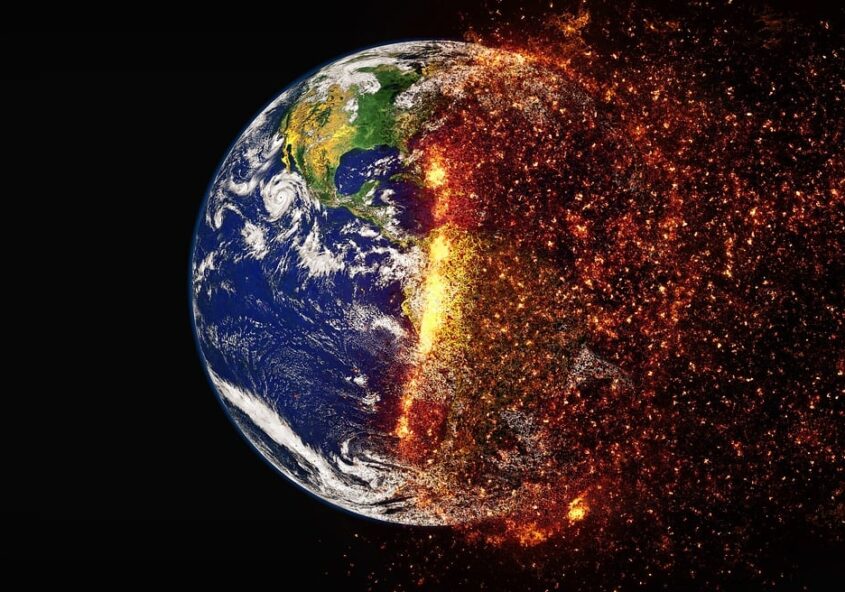 In this image the earth is in the centre and half of it is on fire. This picture depicts the impact of global warming in a visual way.